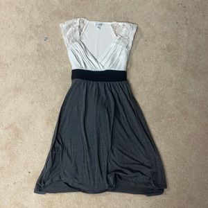 Black, grey, white dress with lace sleeves and tie back. Size XS.